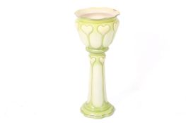 A Grimwade Bros. Staffordshire Vernal Ware lime green jardiniere and stand.