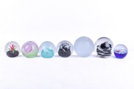 A collection of assorted glass paperweights. Including Caithness Cauldron 8cm diameter, etc.