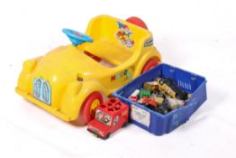 A child's ride on 'Noddy' pedal car. Yellow with red tyres plus some diecast model cars, etc.