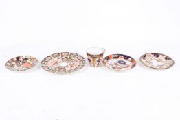 Four items of Royal Crown Derby Japan pattern porcelain. Including saucers and a cup.