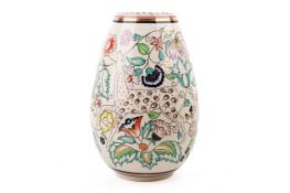 A Poole Pottery 'Persian Deer' vase. Decorated with spotted deer, floral pattern and gilt detail.