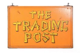 Painted wooden double-sided sign: 'The Trading Post'. 96cm x 62.