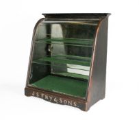 A shop counter-top arched glass display cabinet, J S Fry & Sons to the base.
