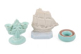 Three mid-century Poole Pottery decorative items.
