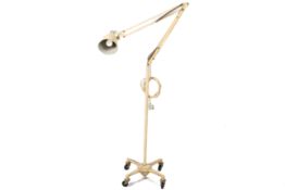 A mid-century Herbert Terry & Sons Ltd 'The Anglepoise' work lamp on a mobile stand.