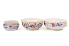 Three assorted mid-century Poole Pottery bowls.