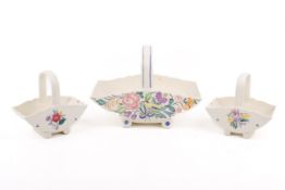 Three mid-century Poole Pottery baskets.