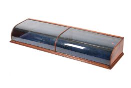 A Victorian mahogany counter-top arched glass display cabinet.