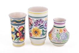 Three assorted mid-century Poole Pottery vases.