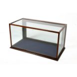 A mahogany framed counter-top 'museum' display cabinet of rectangular form.