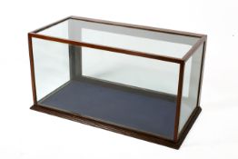 A mahogany framed counter-top 'museum' display cabinet of rectangular form.