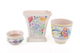 Three assorted mid-century Poole Pottery vases.