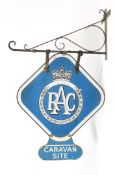 'RAC Caravan Site' double sided enamel advertising sign on a wall bracket.