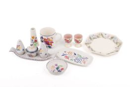 A collection of eight assorted mostly mid-century Poole Pottery tableware items.