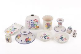 A collection of ten mostly assorted mid-century Poole Pottery items.