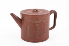 A modern Chinese yixing ceramic teapot. With impressed motifs, marked to base, H10cm.