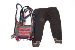 A group of Thai 'Hill Tribe' embroidered shoulder bags and a pair of trousers.