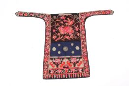 A 20th century Chinese Miao culture embroidered baby carrier.