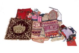 Three Indian or Pakistani embroidered wall hangings and other small pieces.
