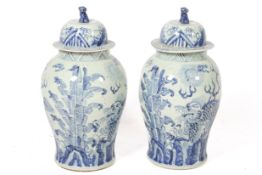 A pair of large 20th century Chinese blue and white lidded baluster vases.