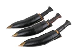 Three vintage kukri knives with scabbards. Blade length circa 24cm.