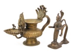 A 19th/20th century Indian bronze oil lamp and a lamp holder.