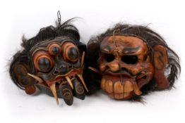 Two Balinese hand carved masks.