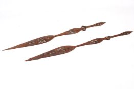 A pair of West African hardwood ceremoinial paddles. With hand carved geometric decoration.