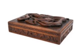 An early 20th century carved wood jewellery box.