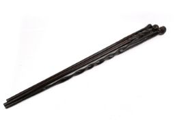 Three African design hardwood carved walking sticks.