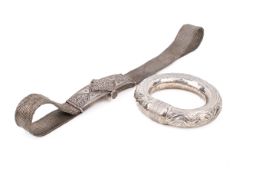 An Omani or Indian white metal woven belt and a bangle.