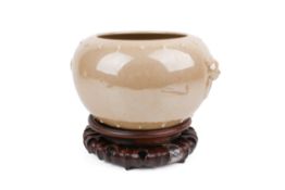 A contemporary Chinese honey glazed storage jar.