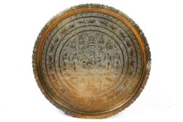 A large Indian brass circular tray and folding stand.