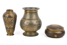 Three Middle Eastern inlaid metal vessels.
