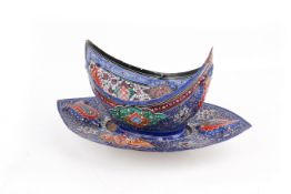 An early 20th century Persian enamel Kashkul and stand.