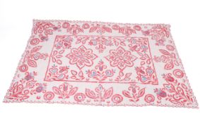 A large blue and red embroidered cotton panel.
