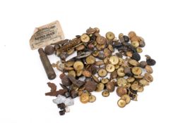 A collection of military badges and buttons and military relics.