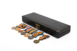 Seven miniature WWI medals.