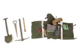 A Civil Defense rescue rucksack kit with pick and shovel. Including rope, saw, cable, blanket, etc.
