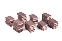 A large group of circa 1930s Oldhams Press Ltd novels in brown bindings.