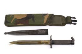 A vintage Swedish military Mauser bayonet with scabbard.