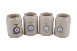A set of four military ceramic tankards.