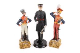 Three assorted ceramic figures of military interest.