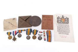 A selection of WWI service medals related to Private Wilfrid Oswald and associated items.