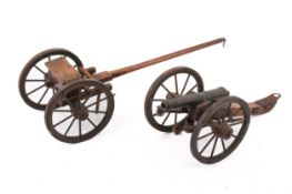 A vintage scratch built model of a canon on carriage.