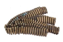 A long bullet belt with empty cartridges. Total length circa 250cm.