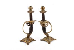 A pair of military officer's sword candlesticks.