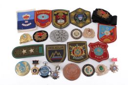 A collection of international military patches, medals and collectables.
