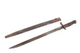 A WWI Remington 1913 pattern bayonet. Marked 6/17, with a wooden handle, in a scabbard, L57.