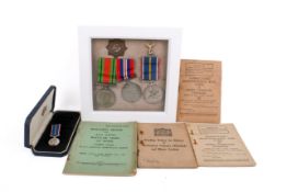 A WWII medal and booklet group.